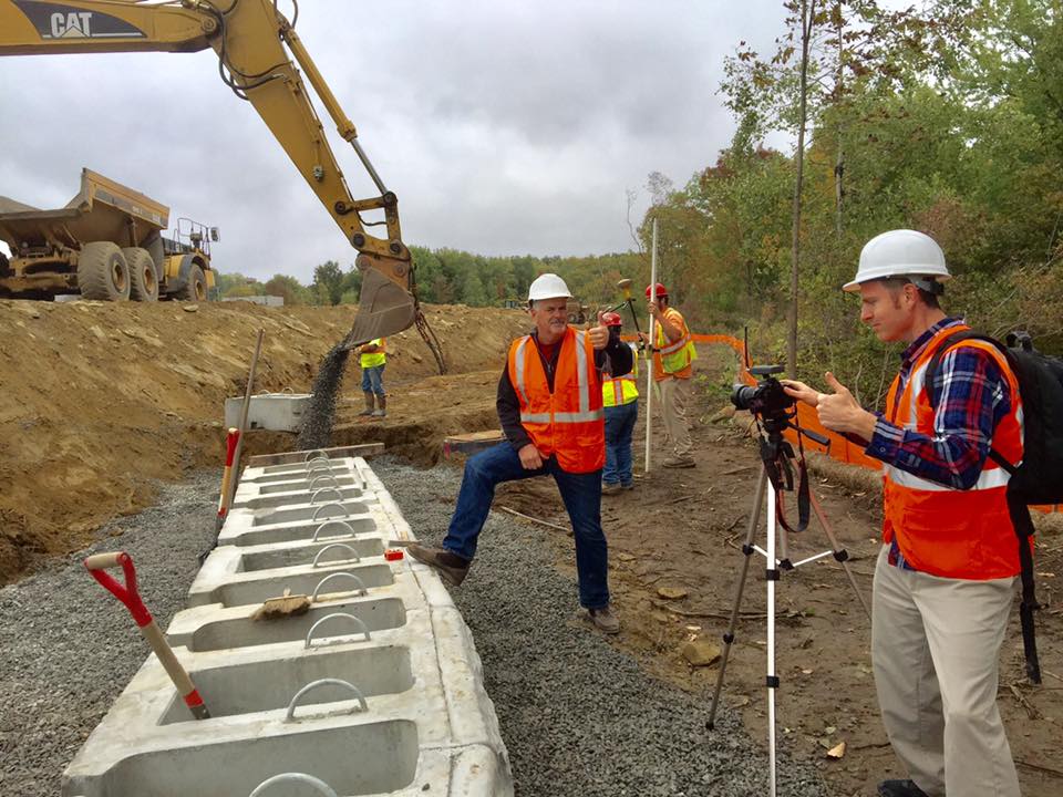 Joe Furlong NH on construction site with American Builder TV show (Apex Center of New England)