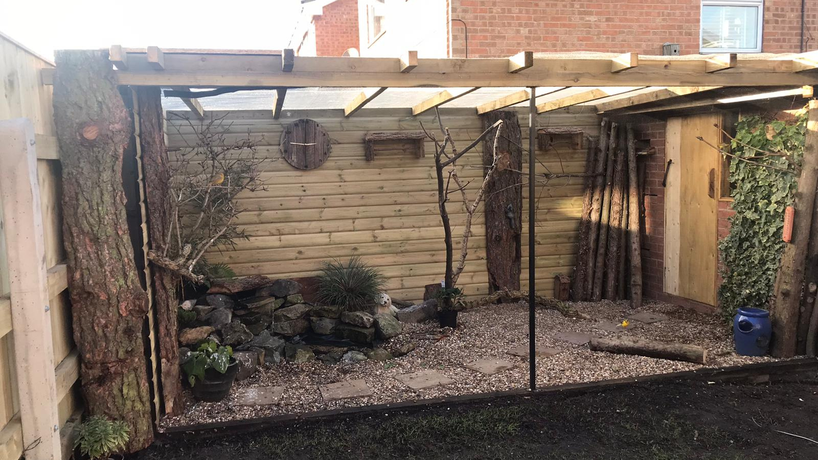 ClearMesh painted black on backyard aviary