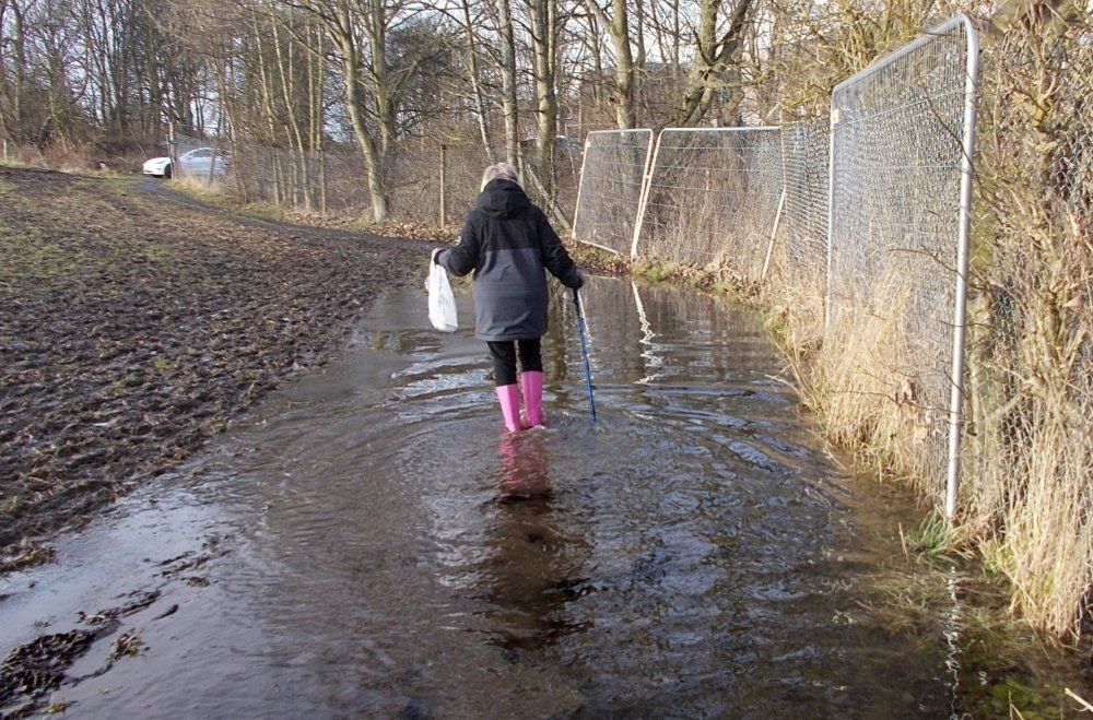 Flood water damaging the Burnside Path Flood water flowing down the Burnside Path