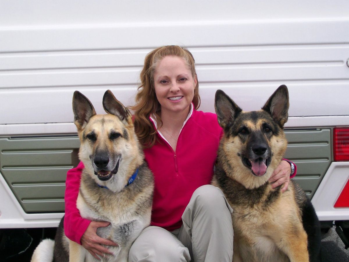 Gina M. Longo with her German Shepherds.
