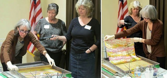 Catherine Levine combs the paints in her marbling tray and pulls a sheet of 17th-century-style marbled paper as Lisa Covert holds the microphone and Gail Sellers watches.