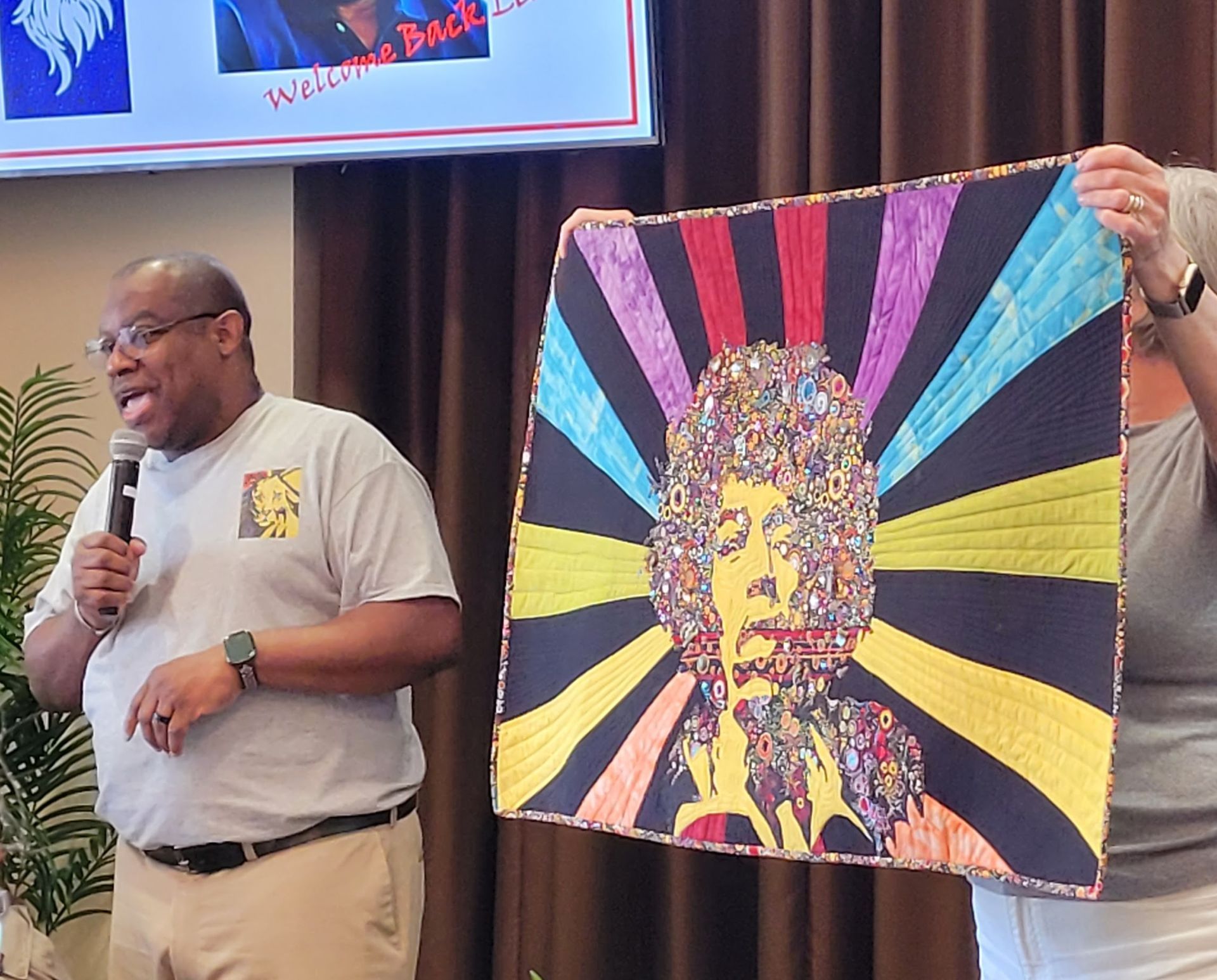 Leo Ransom, presenting his Jimi Hendrix quilt.