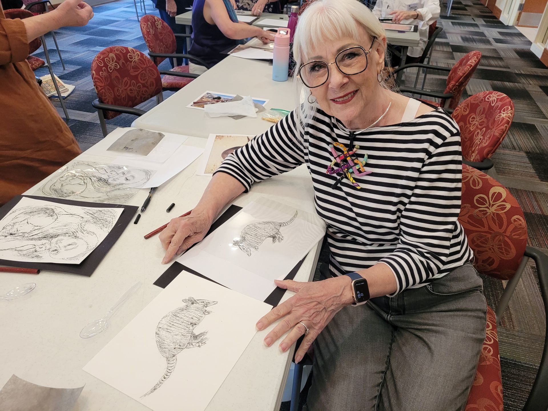 Melanie Dorsey works on an armadillo print in the mini-workshop.