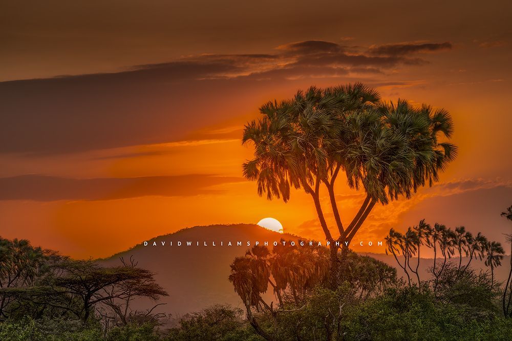 Brilliant colors as the sun sets over the mountains of Samburu, Kenya