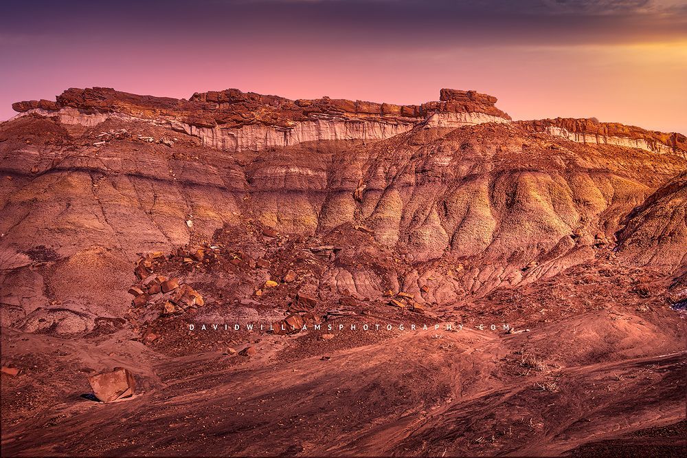 Sunrise light spills across the hoodoos of the Bisti Badlands, New Mexico Sunrise over the Bisti Badlands of New Mexico