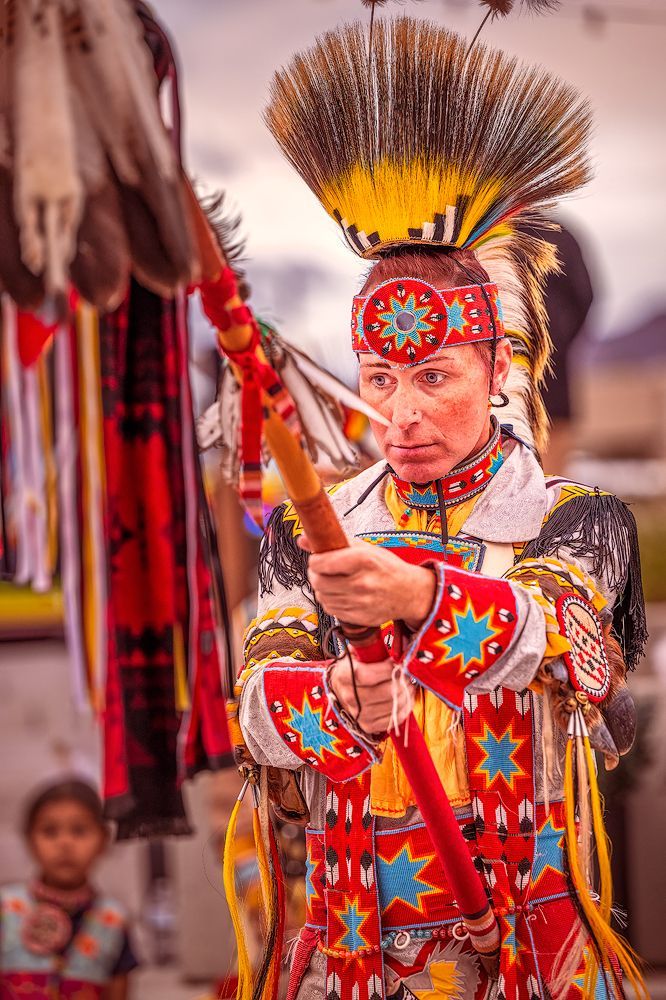 Choctaw Indian in colorful regalia concentrating before a sacred Prayer Dance, showcasing ornate detail, rich textures, and vibrant colors