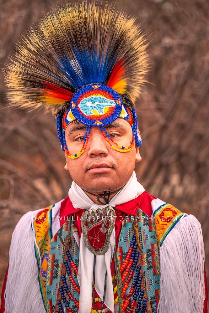 Portrait of a Native American individual in colorful traditional regalia during Native American Heritage Month in Salt Lake City, Utah.