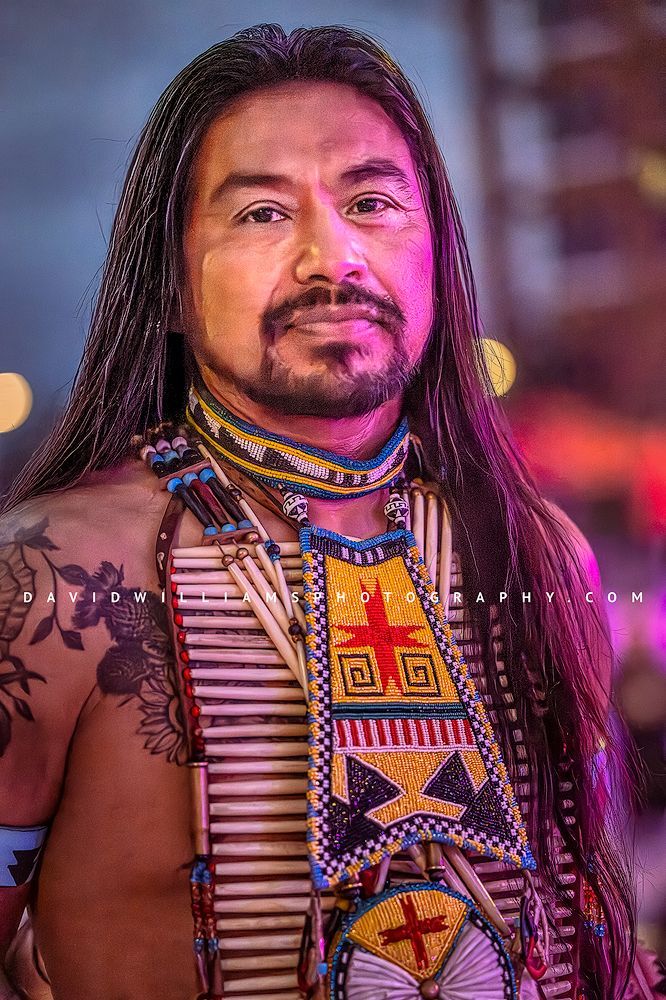 Vertical fine art portrait of a Hopi Indian spokesman in ornate ceremonial attire, representing heritage, leadership, and cultural storytelling.