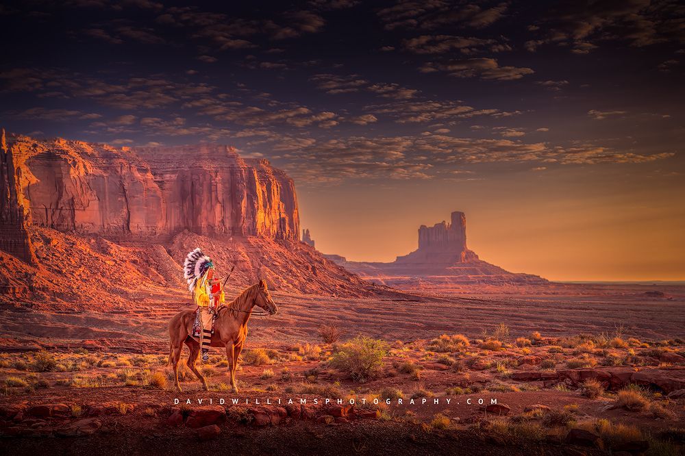 A Navajo Indian in tribal clothing on horseback, Monument Valley