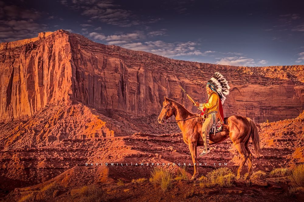 Navajo Indian in tribal clothing on horseback at sunrise, Monument Valley
