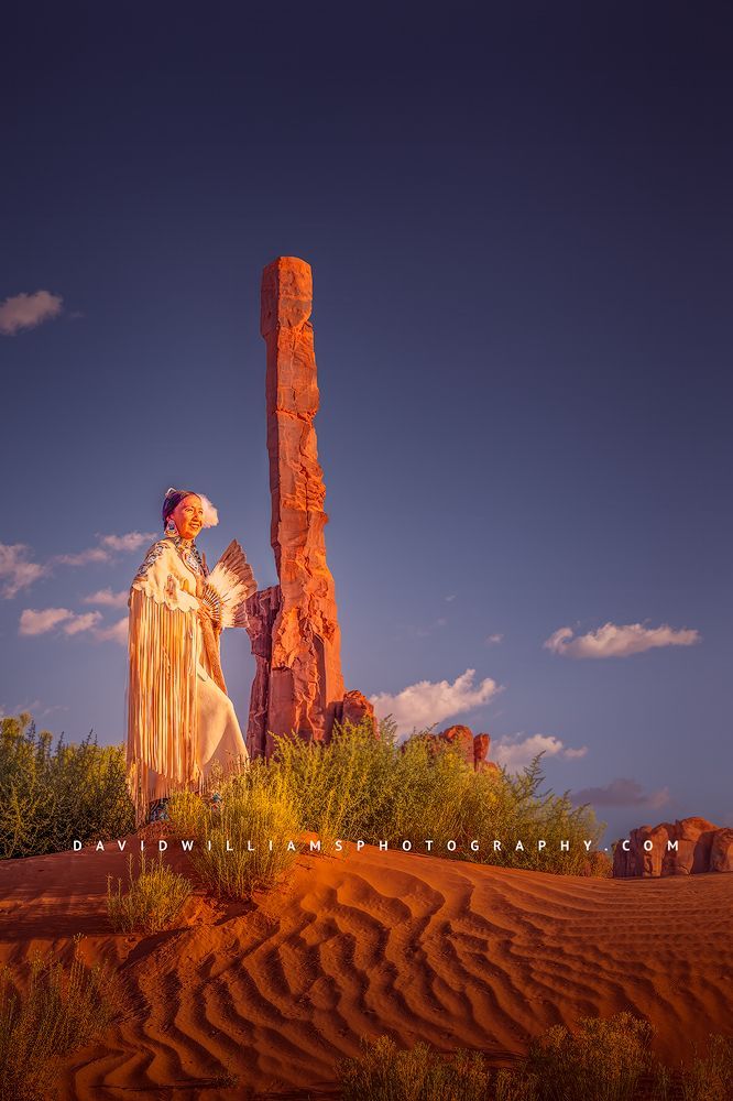 A Navajo woman inn tribal clothing, Totem Pole, Monument Valley