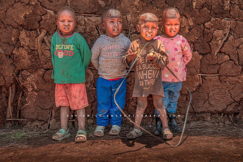 4 Maasai children in ragged clothing, Amboseli, Kenya