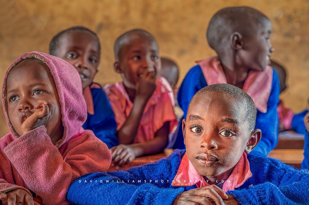 Kenyan children in an elementary classroom in morning light