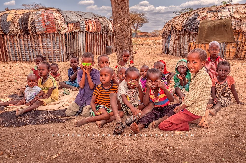Maasai children smiling and showing off their personality, Samburu, Kenya