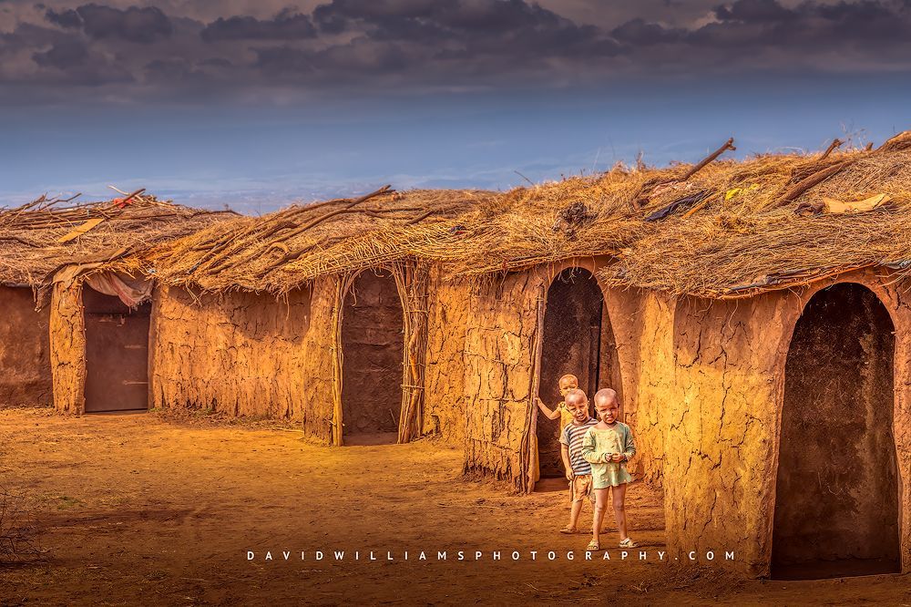 3 Maasai children outside village their mud home Kraal, Kenya, Africa