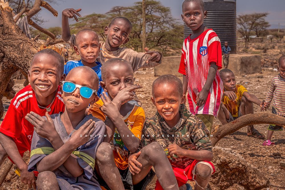 Maasai children smiling and showing off their personalities, Samburu, Kenya