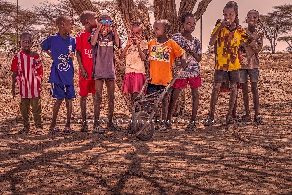 Maasai children smiling and showing off their personalities, Kenya