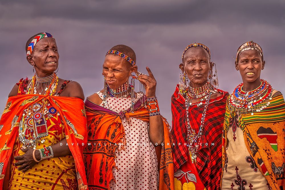 4 Maasai tribal women in traditional jewelry and clothing, Kenya, Africa