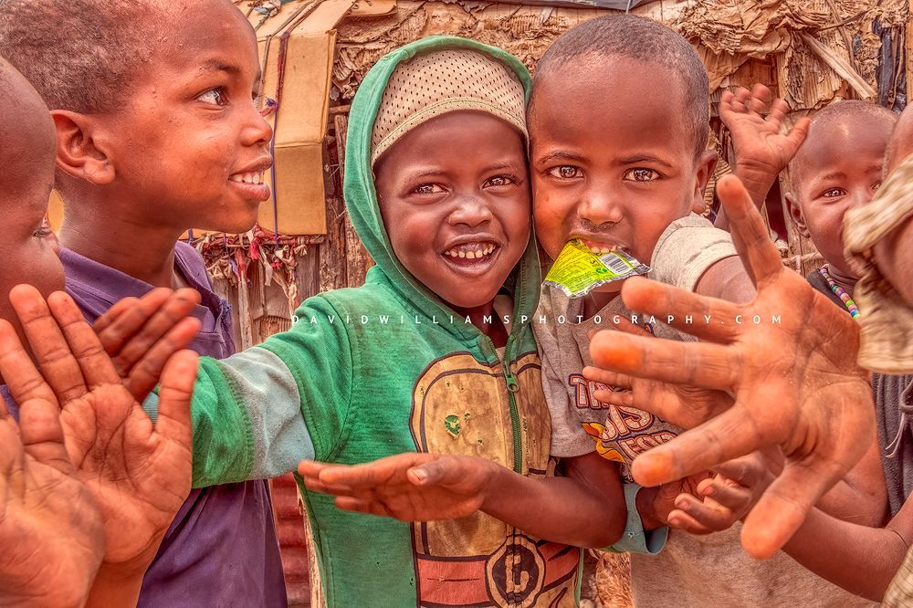 Maasai children smiling and showing off their personalities, Samburu, Kenya