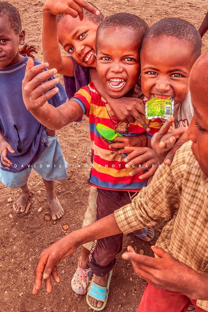 Maasai children playing and showing off to the camera, Kenya, Africa