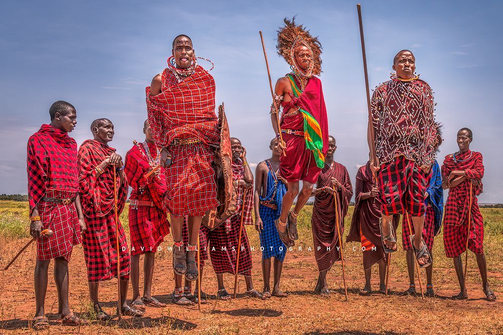 3 Maasai Tribal men performing Jump ritual, Kenya