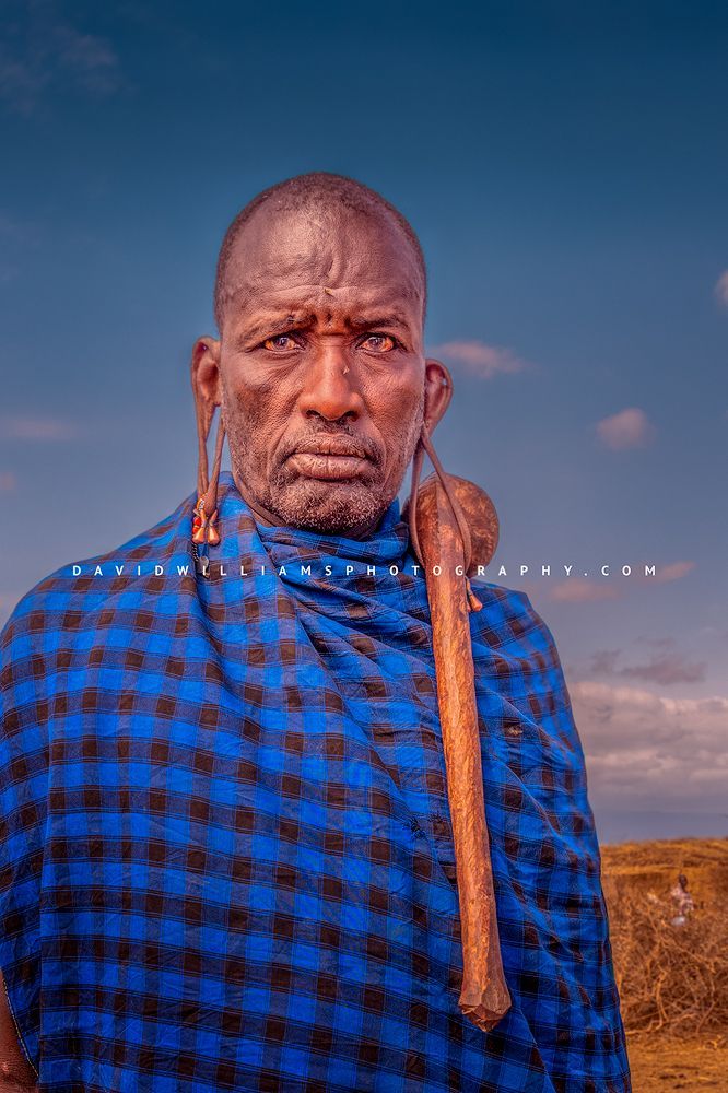 A Maasai male with rungu hanging from earlobe, Kenya