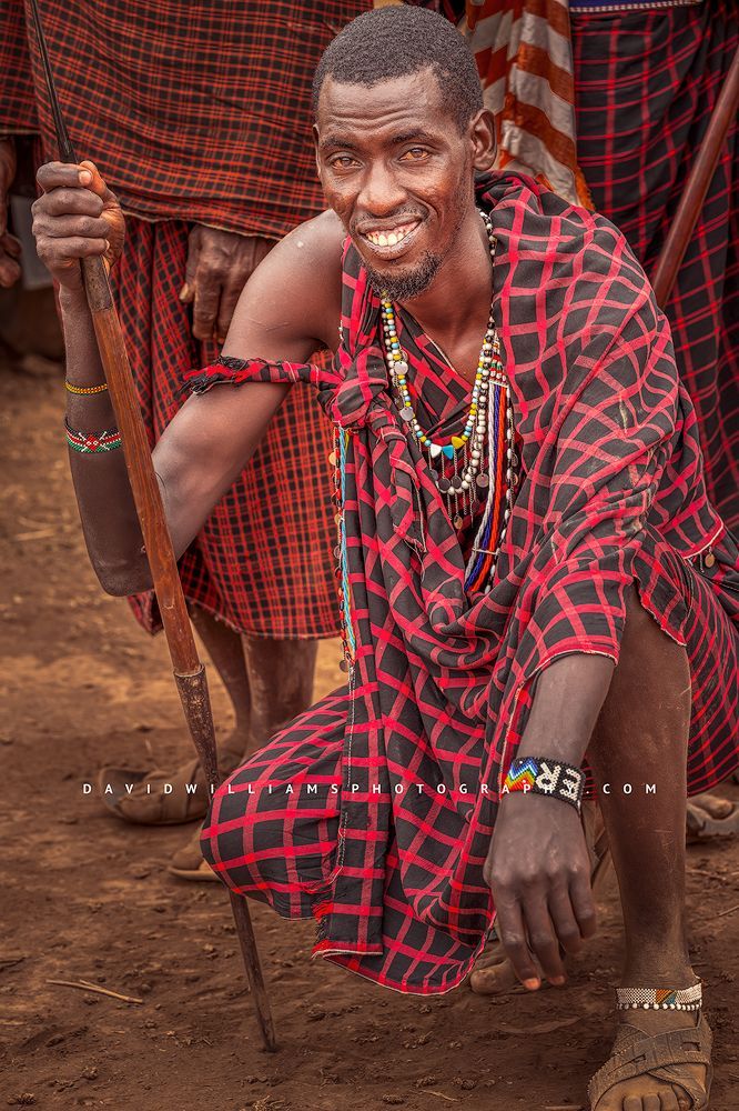 A handsome happy Maasai Warrior with spear, Kenya, Africa