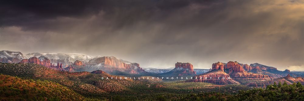 A crisp Winter evening with snow capped mountains and fog over the mountains of Sedona Arizona