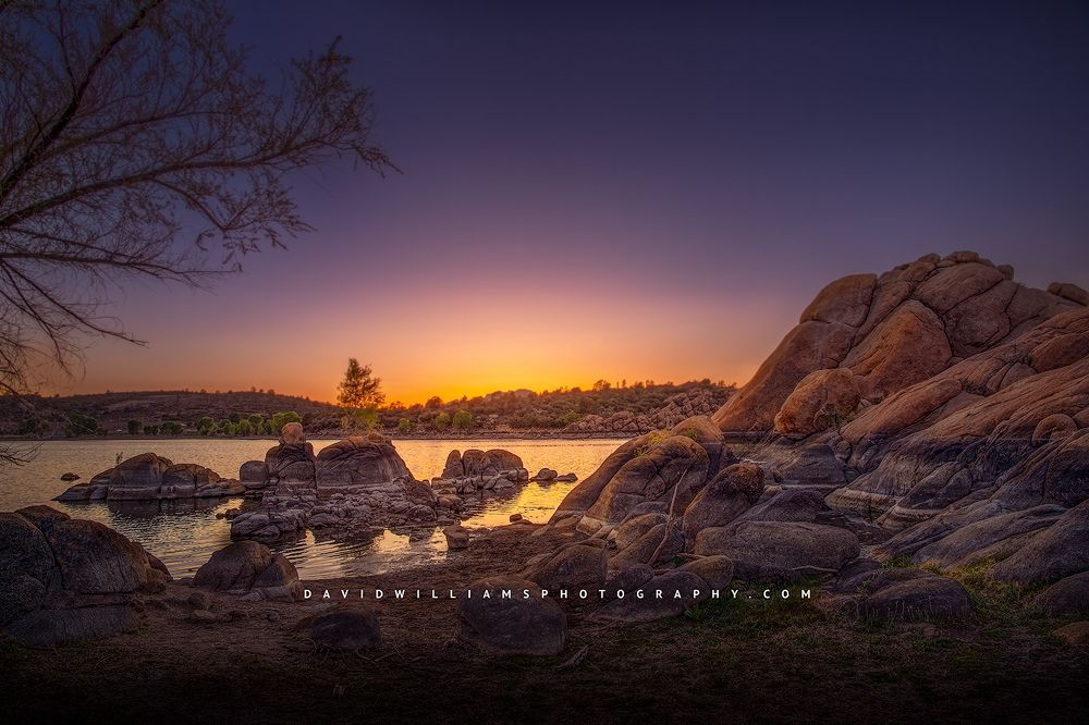 Sunset reflections in the still waters at Watson Lake, Arizona.