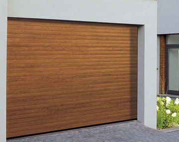 Menuiserie Vautier (95) fabrication traditionnelle de portes de garage en bois à enroulement Menuiserie Vautier (95) fabrication traditionnelle de portes de garage en bois à enroulement