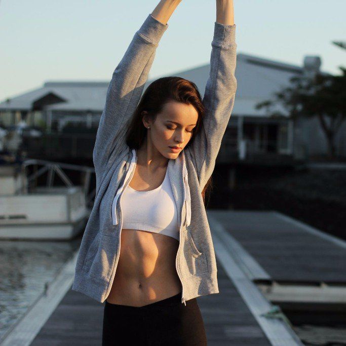 Woman with raised arms, overcoming emotional difficulties through Steady Sense.