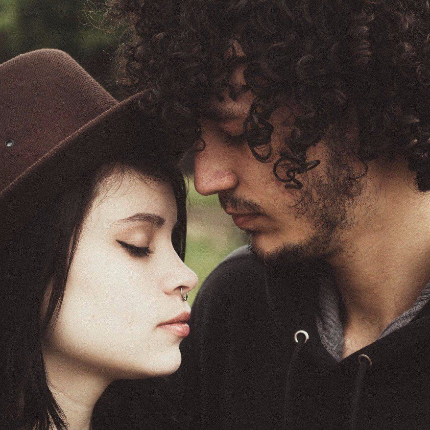 Couple leaning foreheads together, overcoming emotional difficulties through Steady Sense..