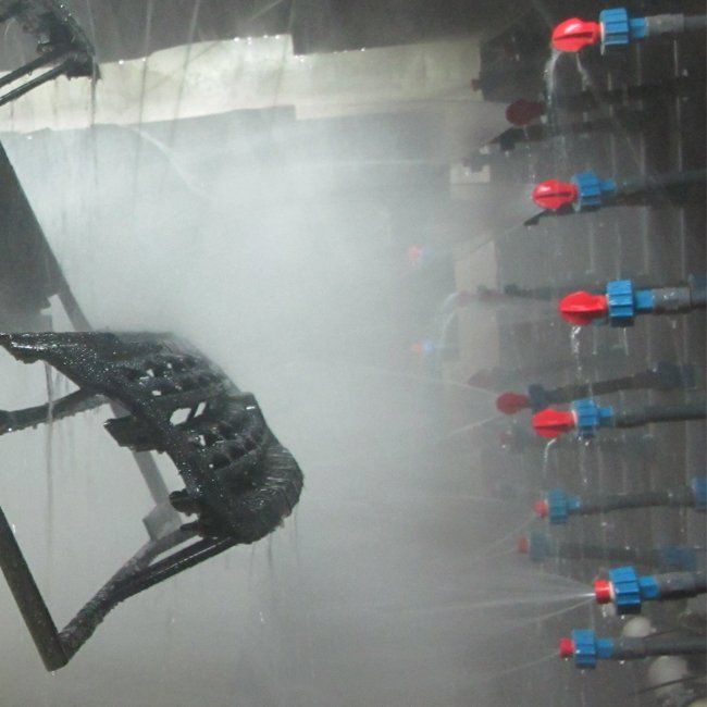 Pre-treatment spray nozzles in an automotive parts factory.