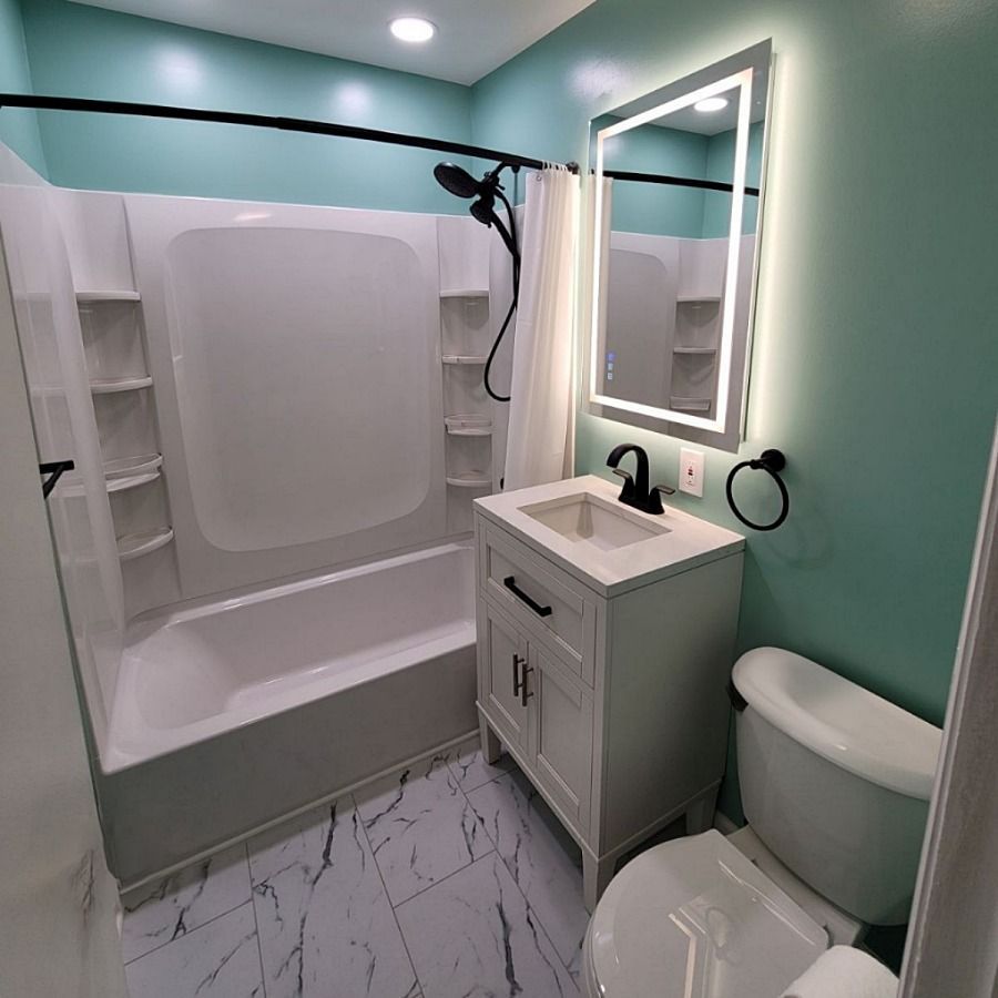 Renovated bathroom by The Renovation Copmany - size 5x8 with acrylic tub and wall panels