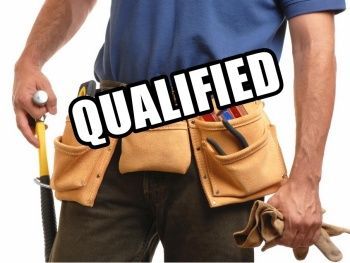 a carpenter with an apron loaded with tools, and the word