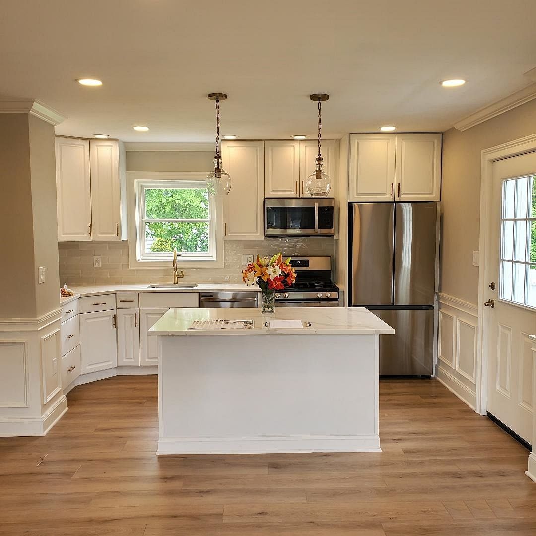 Renovated kitchen by The Renovation Company in a 1950's cape cod home