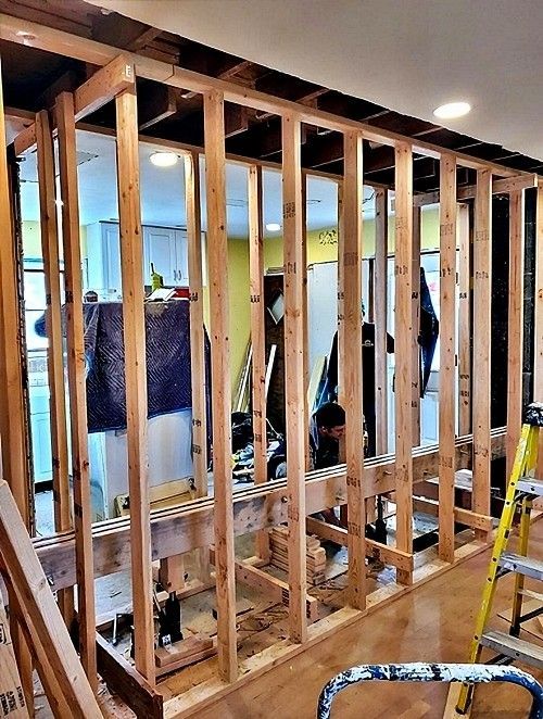 a flitch beam staged between stud walls before installation