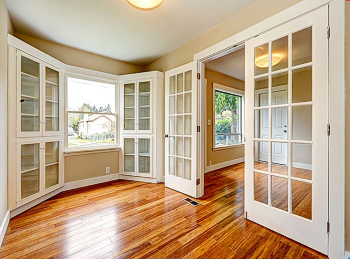 Interior french doors with glass panes, and a beautiful hardwood floor