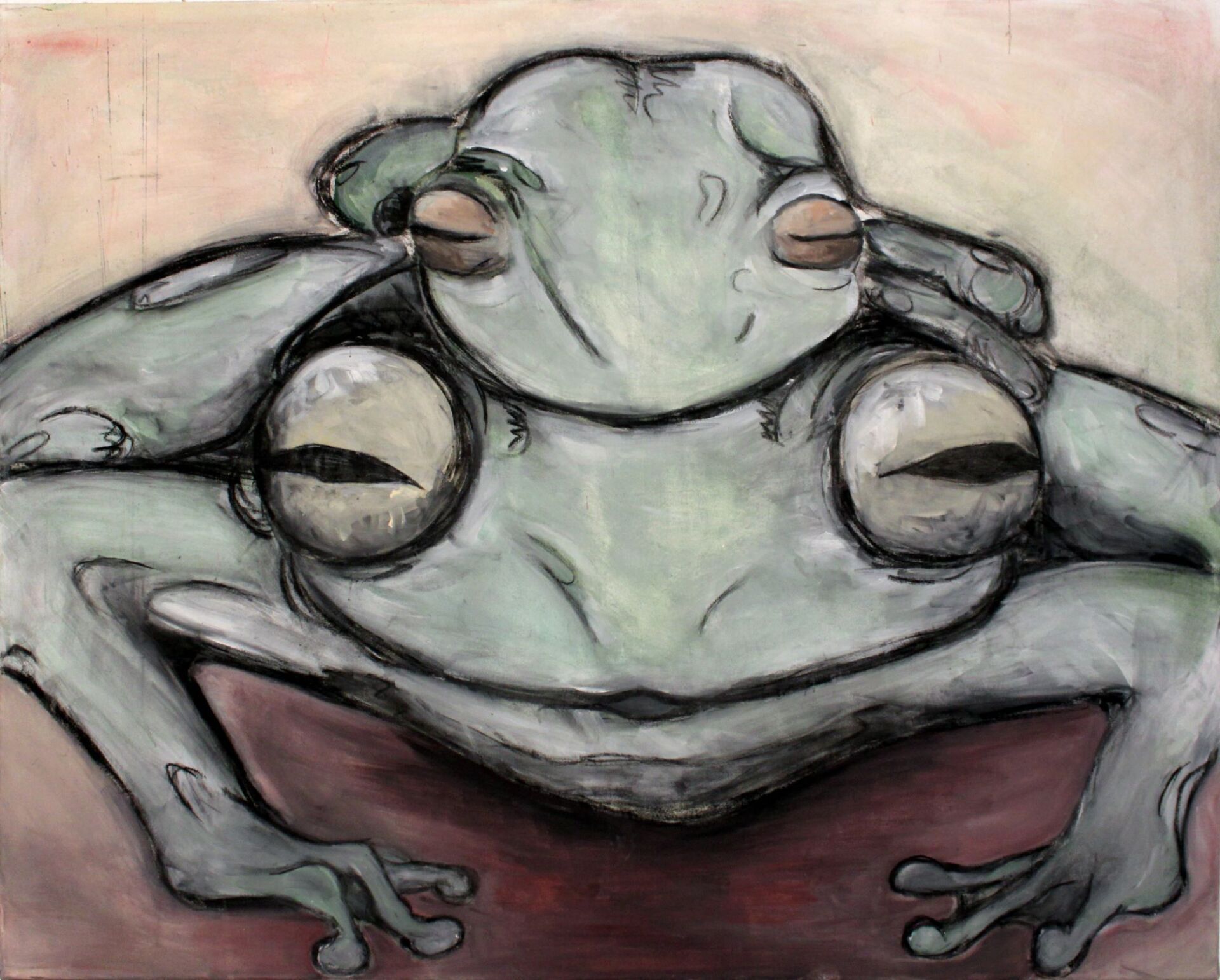 Zwei aufeinander hockende Frösche