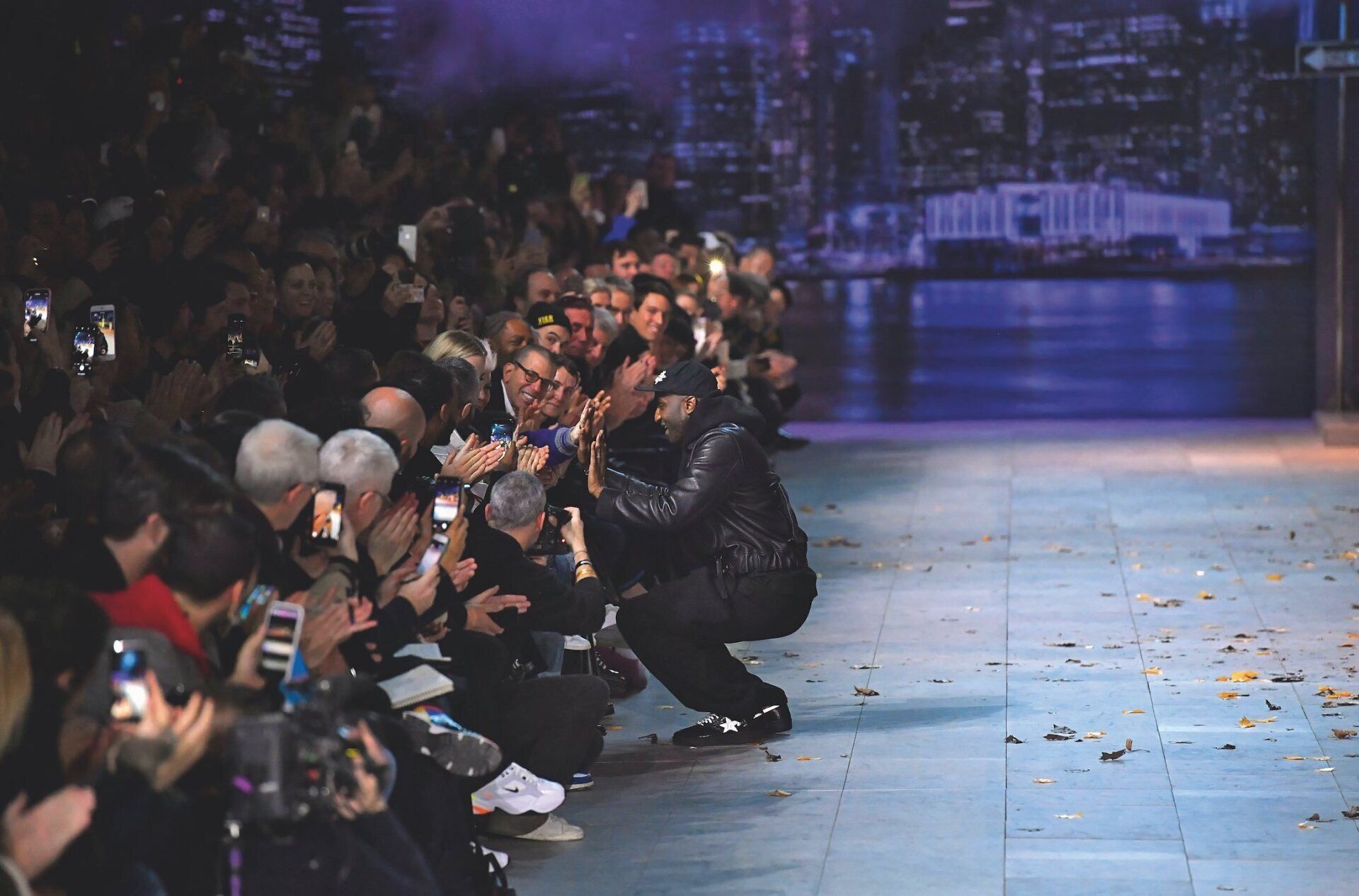Virgil high-fives his daughter, Lowe, and his son, Grey—sitting next to his wife, Shannon—as he takes his bow at the Louis Vuitton fall-winter 2019 show. His family served as the greatest motivation in his mission to create a compassionate and tolerant world for the future. Victor Virgile Gamma Rapho Getty Image Alethea Magazine