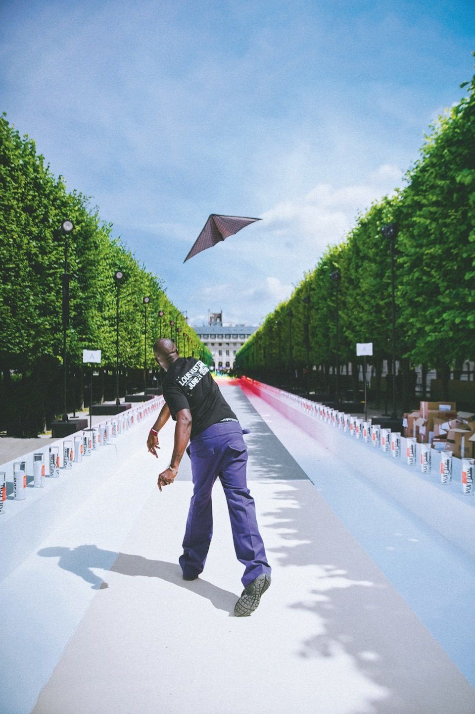Virgil Abloh launches a paper plane on the rainbow-colored runway at his Louis Vuitton spring-summer 2019 show in the Palais-Royal garden. Paper planes became a symbol of the childlike approach Abloh wanted to inspire in his audiences. © Bogdan “Chilldays” Plakov Alethea Magazine