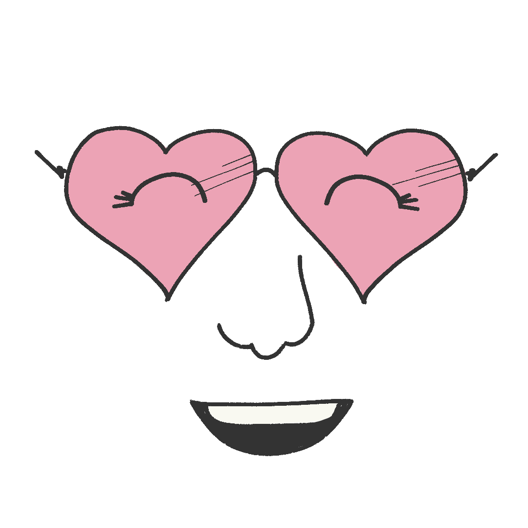 A smiling face wearing heart shaped glasses