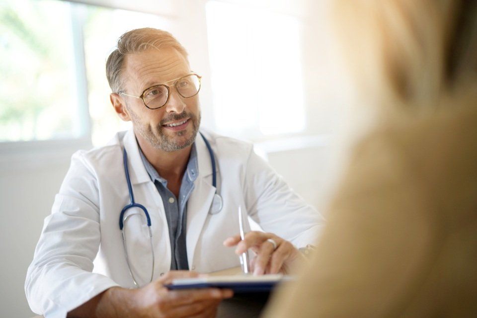 a doctor speaking with a patient