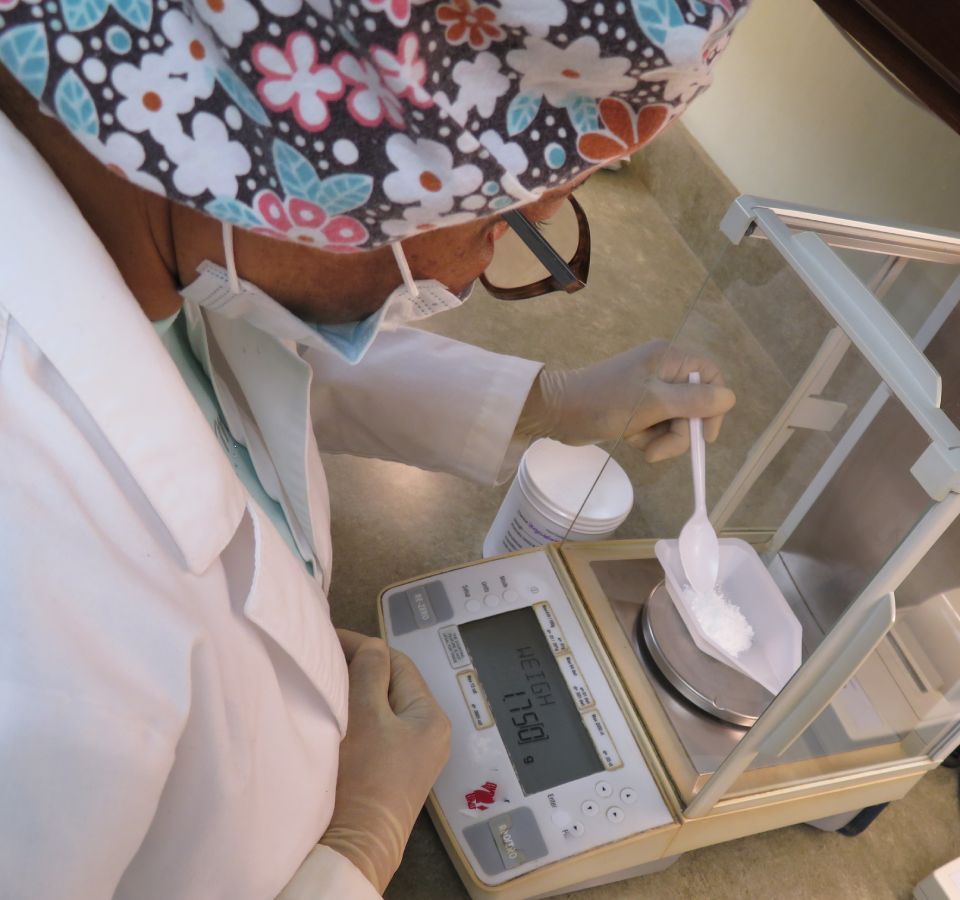 a nurse measuring out dosage of medicine