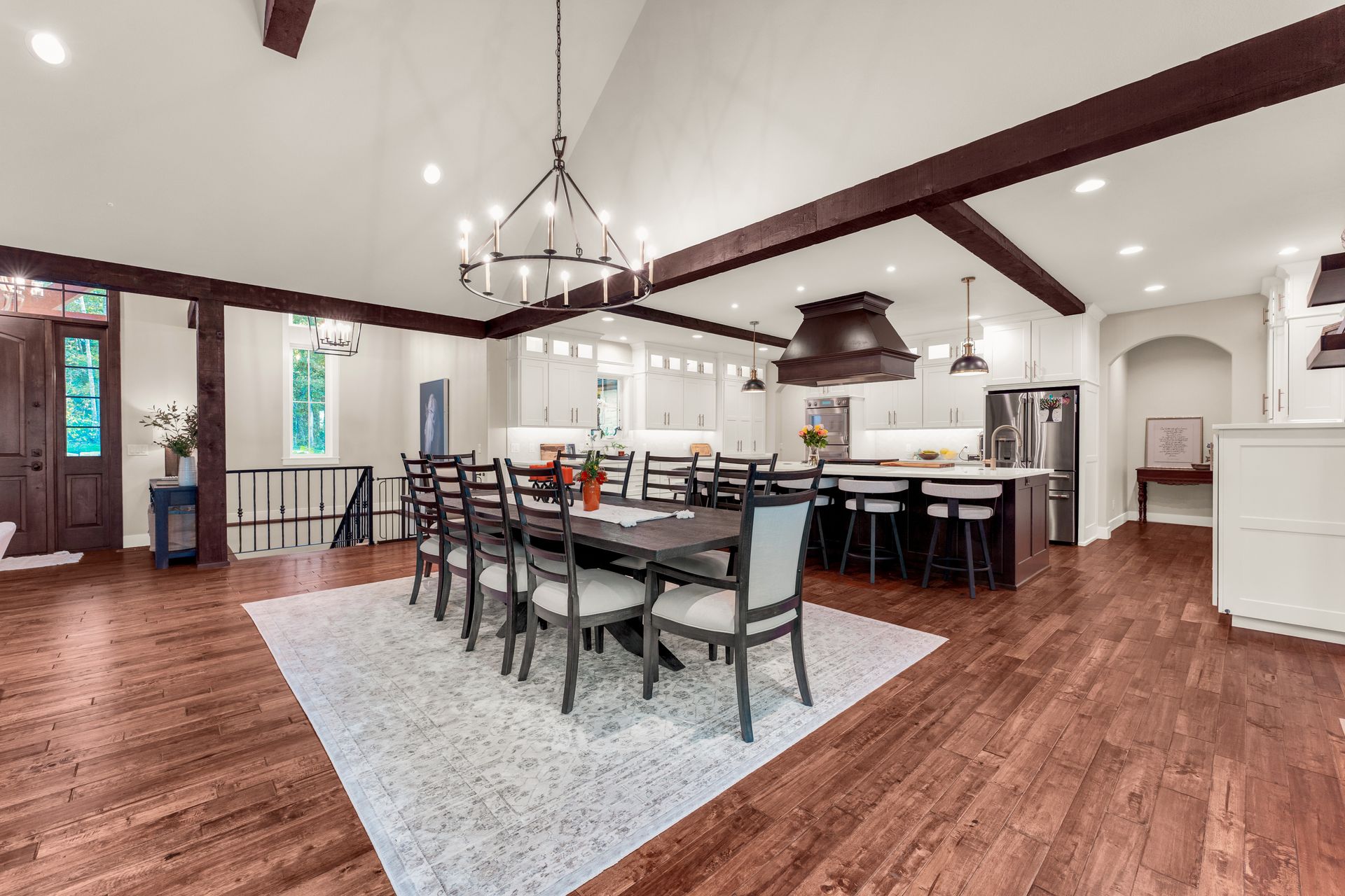 An interior real estate photo of a luxury home's dinning room and kitchen areas. Professional photo by Jennifer White Timeless Moments Photography. Home built by Old World Cottages near Springfield Missouri.