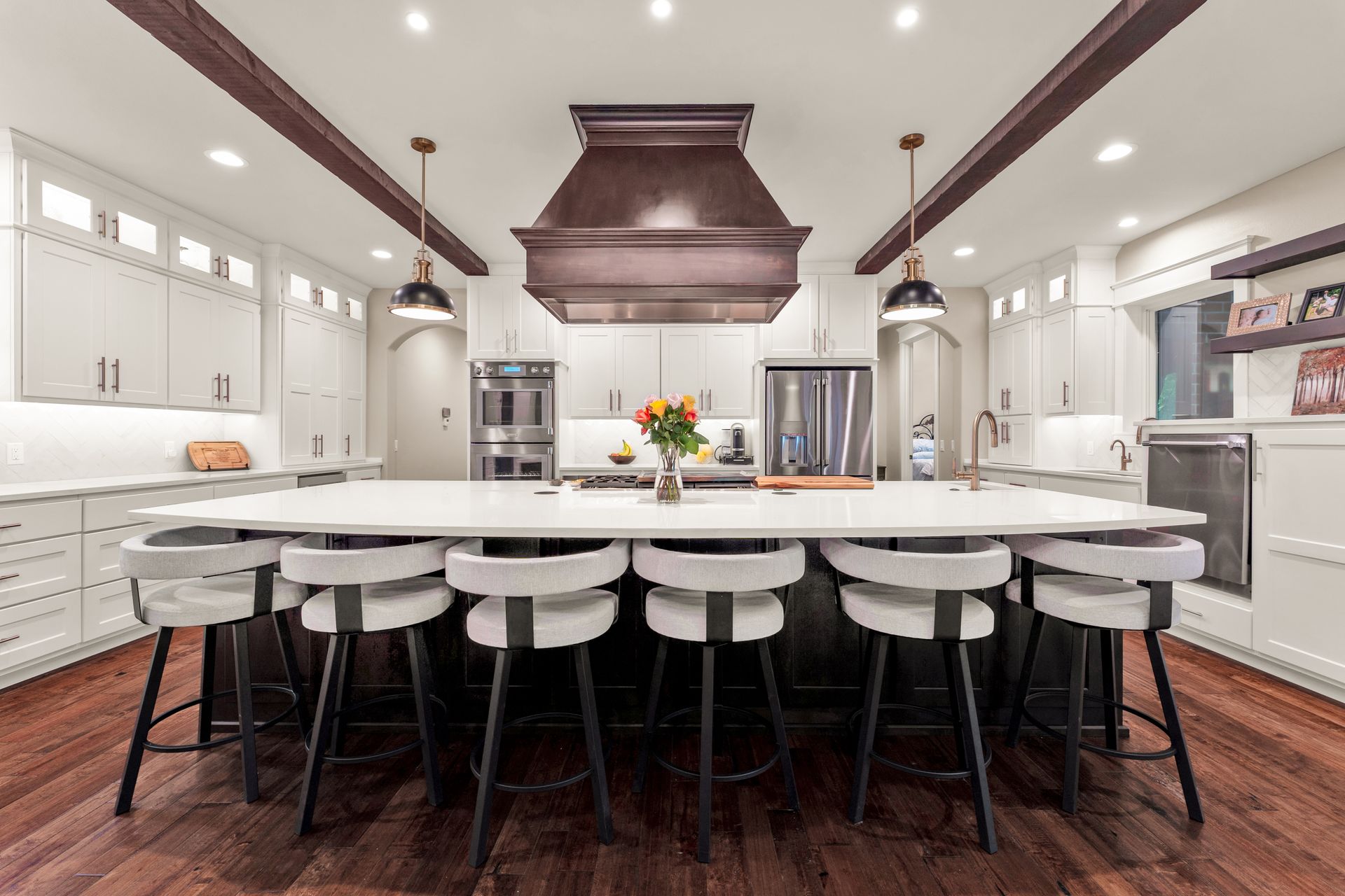 An interior real estate photo a high end kitchen looking straight on. Professional photo by Jennifer White Timeless Moments Photography. Home built by Old World Cottages near Springfield Missouri.