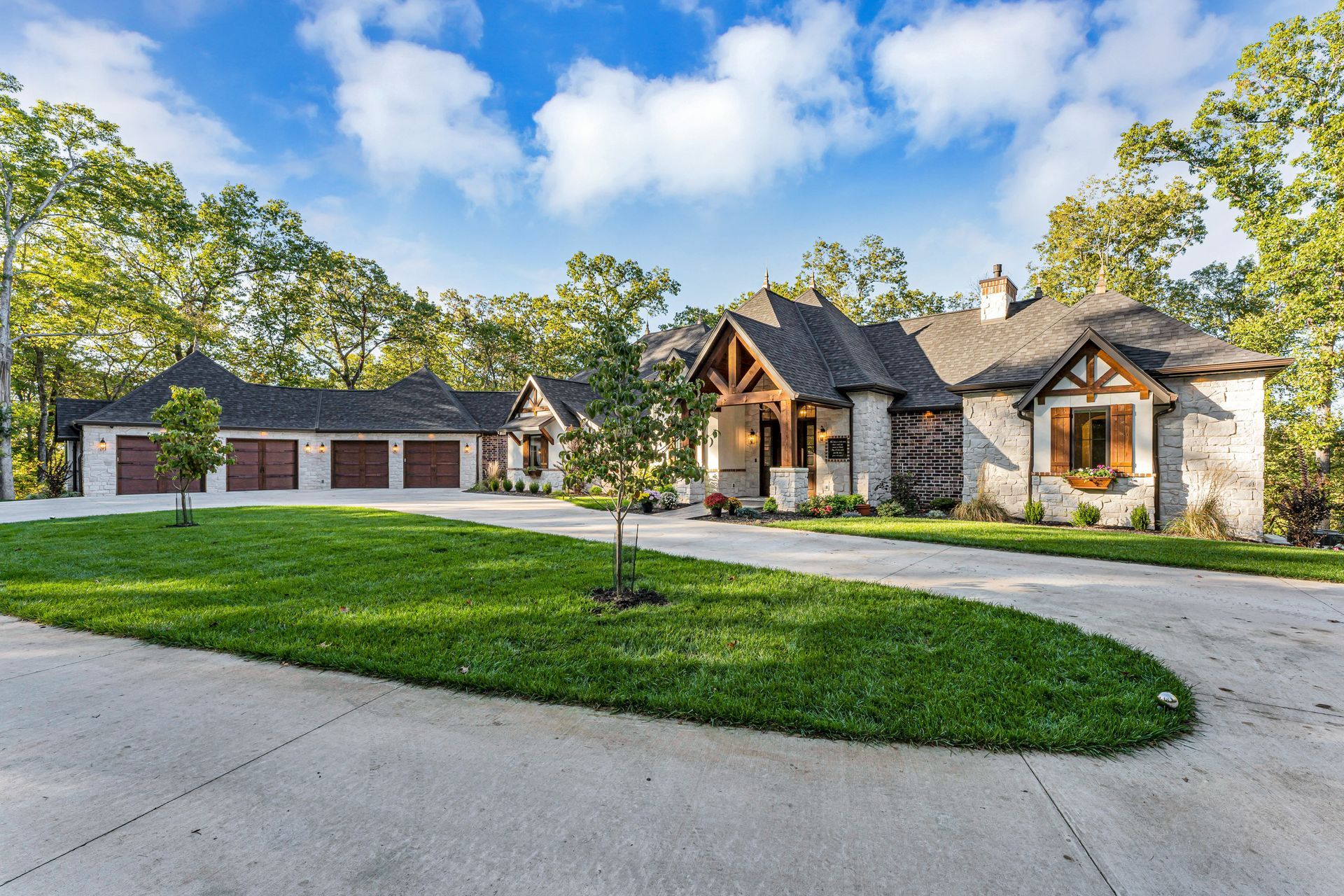 An exterior of a beautiful luxury home. Professional real estate photo by Jennifer White Timeless Moments Photography. Home built by Old World Cottages near Springfield Missouri.