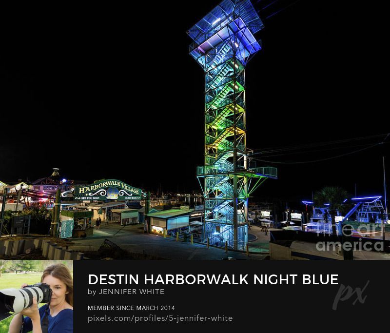 A night scene of the HarborWalk Village and shopping area in Destin Florida by Jennifer White with Timeless Moments Photography.