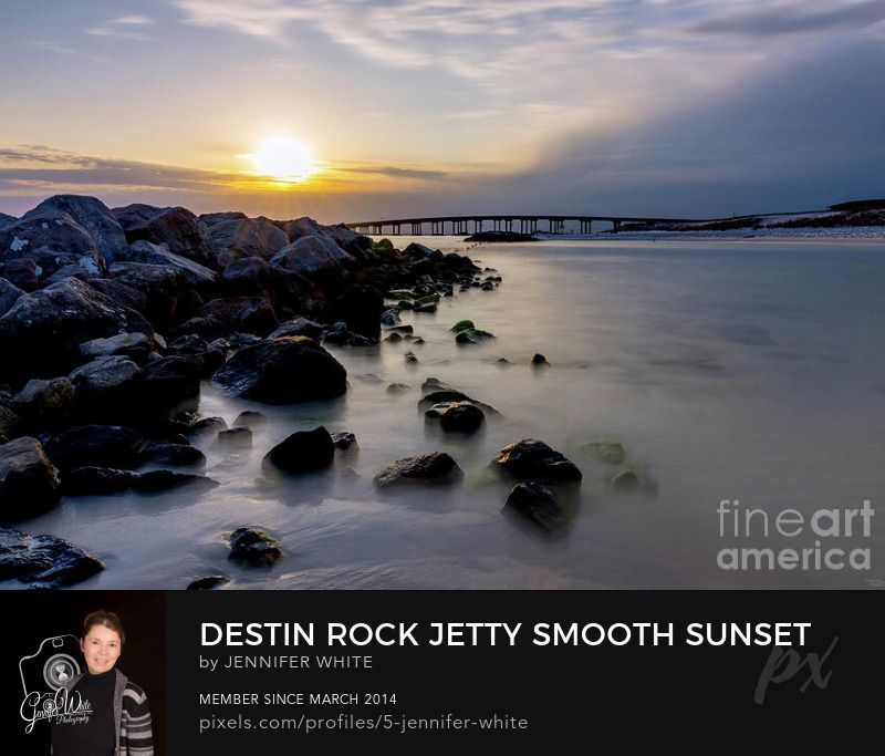A long exposure to capture the movement of the water along a rock jetty at Snorkel Beach in Destin, Florida during sunset.