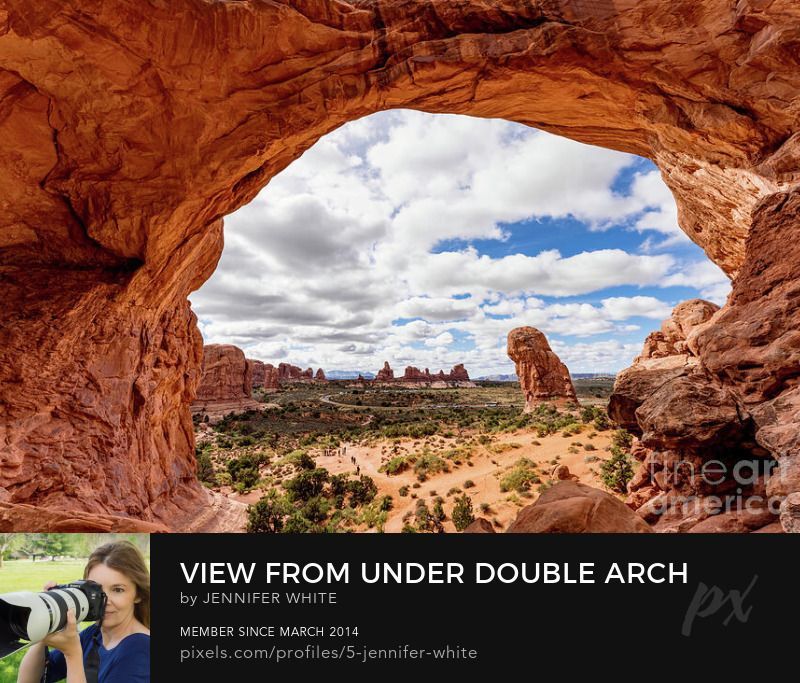 The view you see when you climb up into Double Arch at Arches National Park looking toward Turret Arch and the North and South Windows in the Windows section of the park.